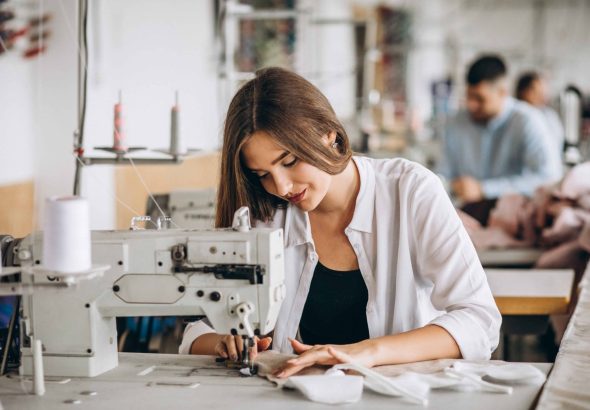Woman tailor working at the sewing factory
